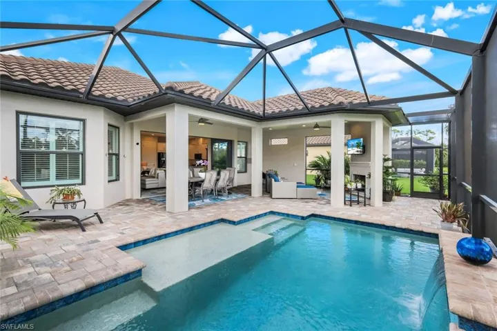 Lanai, saltwater pool with Sun Shelf Waterfall and Preserve view
