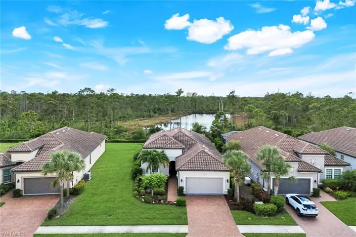 Front of home with preserve lake in back