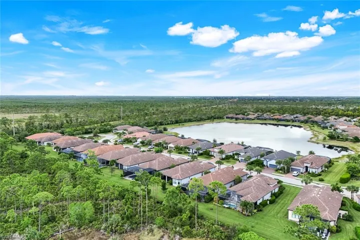 Aerial overview of property's location with a nearby body of water and nearby suburban area