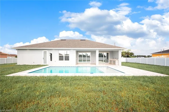 View of swimming pool featuring a lawn and a patio area