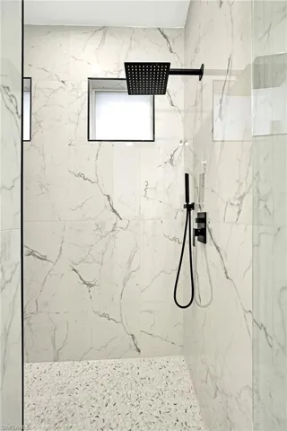 Bathroom featuring tiled shower