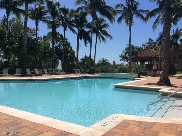Community pool with a patio and a gazebo