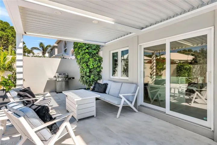 View of patio featuring an outdoor living space and grilling area