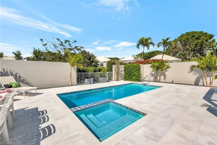 View of pool featuring a fenced in pool, a patio, an in ground hot tub, and a fenced backyard
