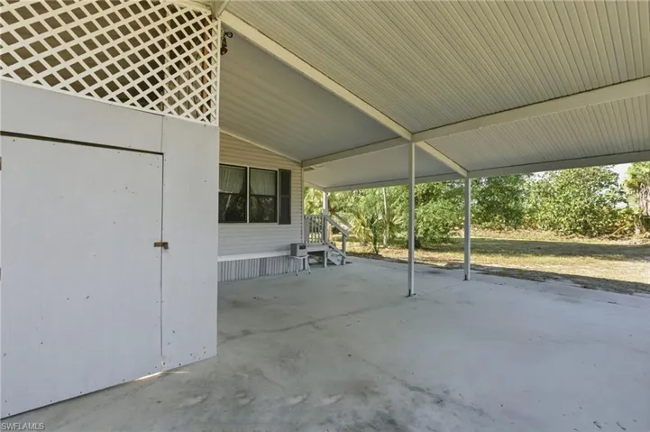 View of patio featuring an attached carport