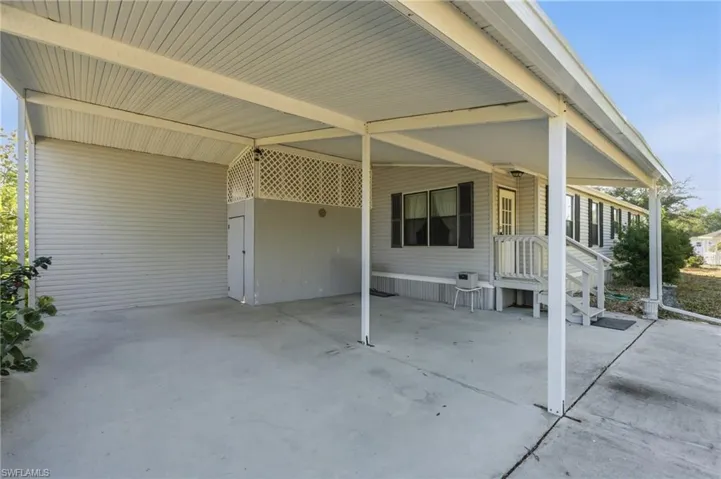View of patio / terrace featuring an attached carport