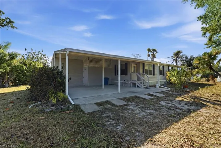 Rear view of house featuring a patio area