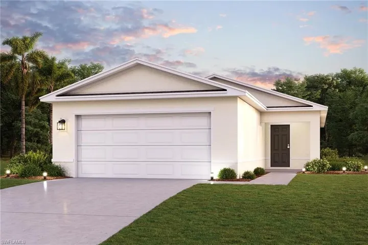Ranch-style home with a yard and a garage