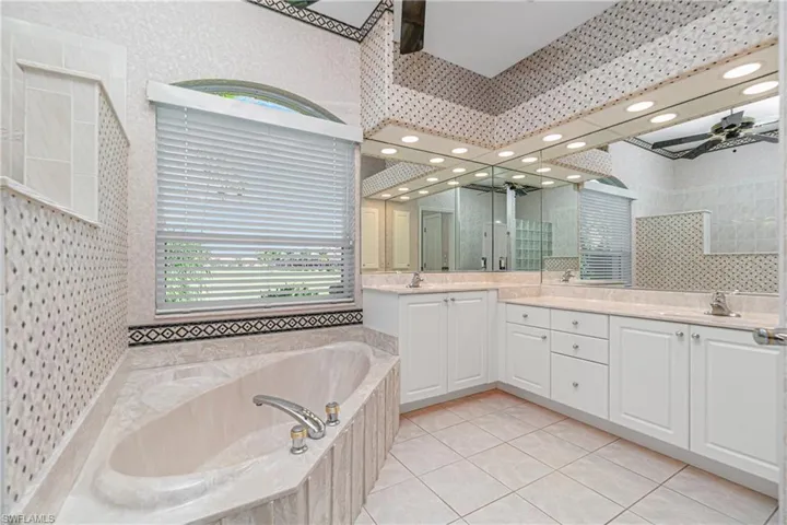 primary bath with soaking tub and shower