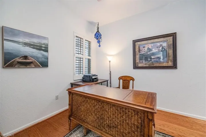 Office area featuring hardwood / wood-style flooring