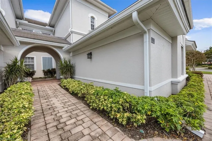 View of side of home featuring a patio