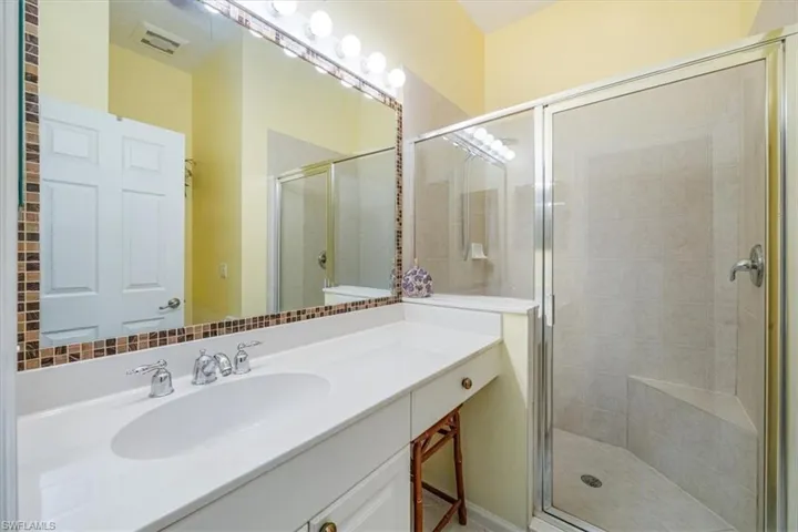 Bathroom featuring vanity and walk in shower