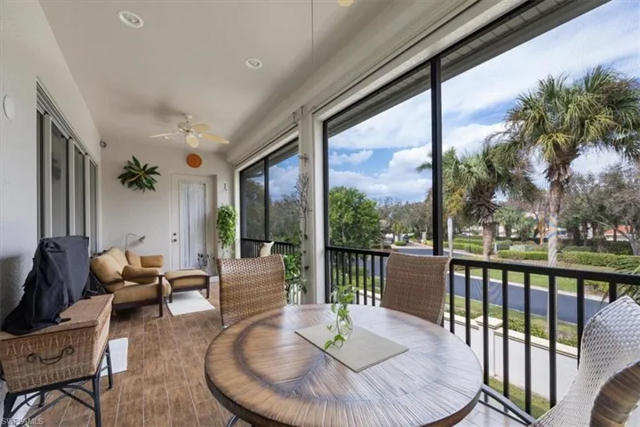 Sunroom / solarium featuring ceiling fan
