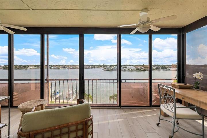 The spacious enclosed waterfront lanai is an inspiring work from home spot, though dolphin watching, bird watching and beautiful boat watching may distract!