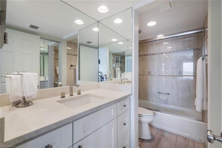 Primary en-suite bath with a large walk-in closet