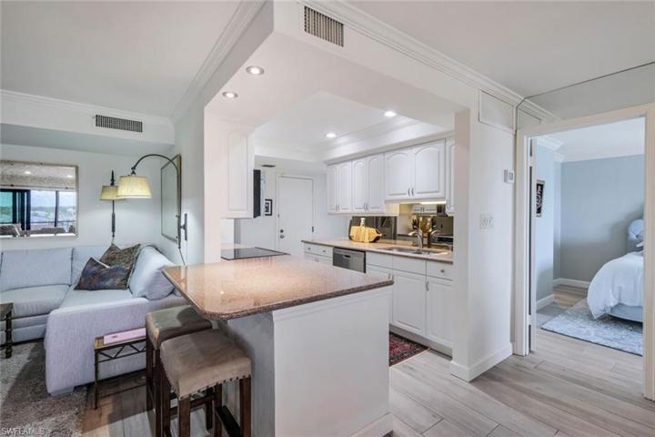 The efficient kitchen has seating at the spacious peninsula
