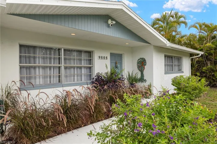 View of exterior entry featuring stucco siding