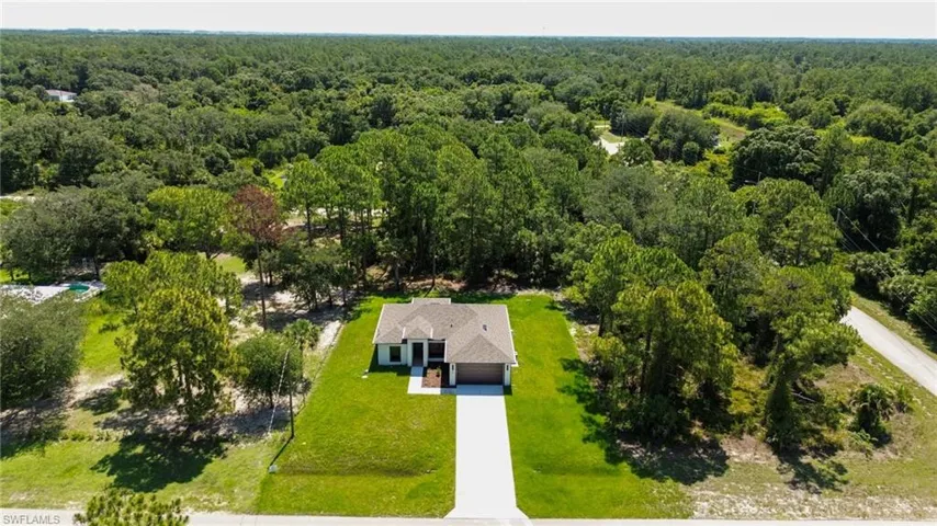 Contemporary single-story residence featuring a two-car garage and a paved driveway