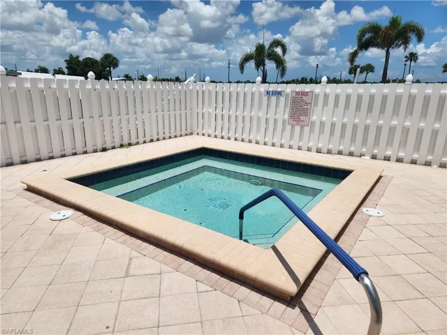 View of pool featuring a hot tub