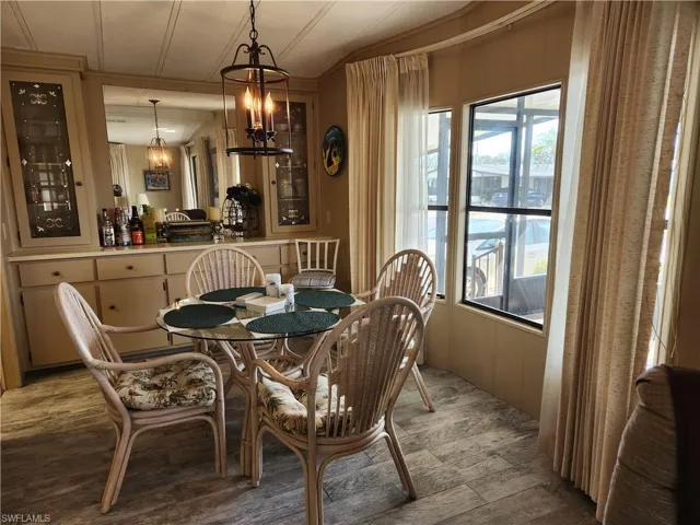 Dining area featuring a wealth of natural light and a chandelier