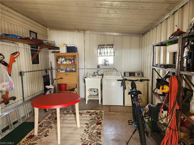 Basement with washer and dryer and sink