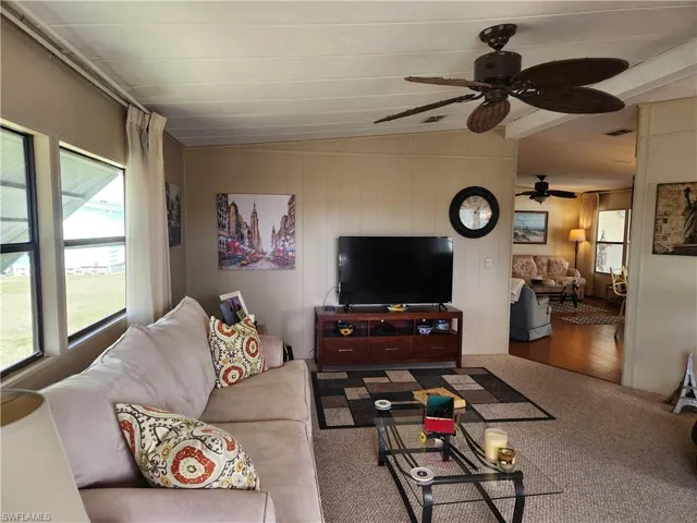 Living room featuring ceiling fan