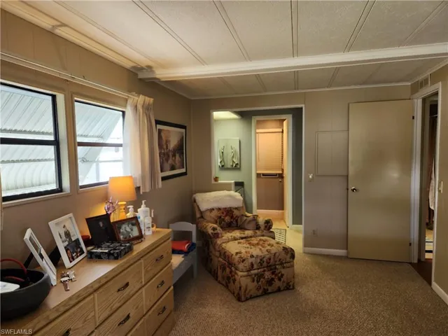 Living area with carpet flooring