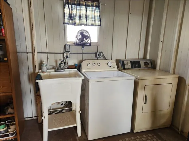 Clothes washing area with washing machine and clothes dryer