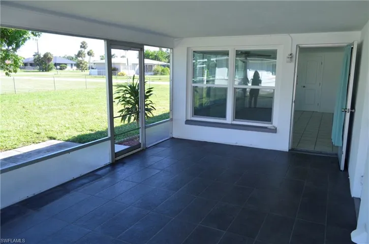 Unfurnished sunroom with a residential view