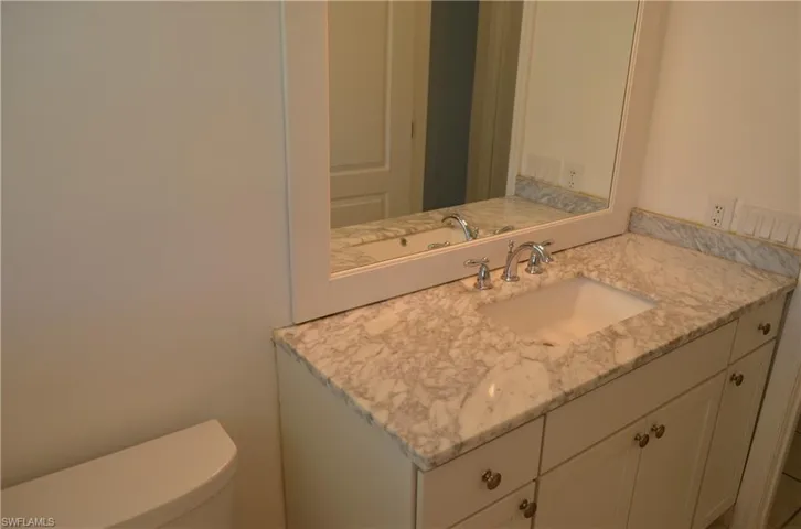 Bathroom with vanity and toilet