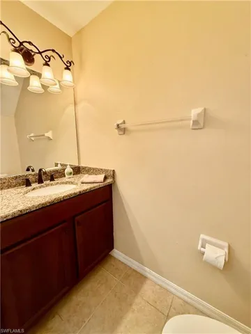 Bathroom with tile flooring and vanity