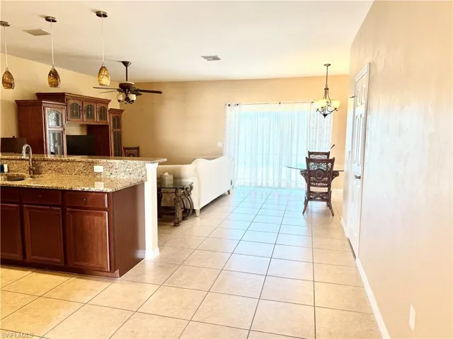 Walkway leading to the kitchen, living, and dining areas.