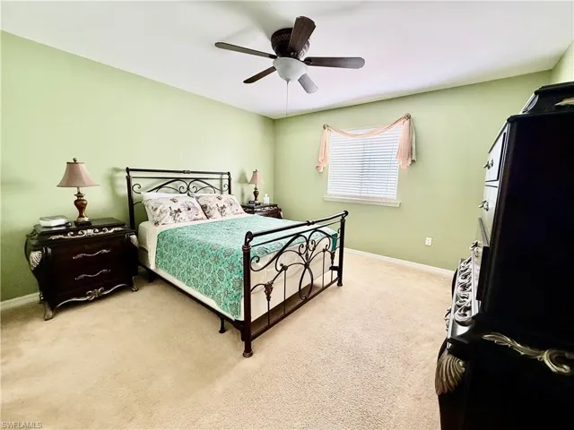 Bedroom featuring carpet floors and ceiling fan