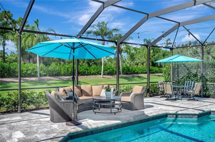 Outdoor pool featuring a lanai and a sunroom