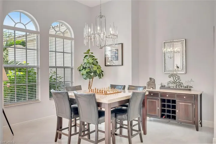 Dining room with plenty of natural light and a chandelier