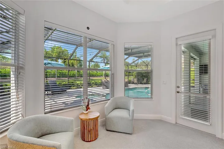 Sitting room with carpet and healthy amount of natural light