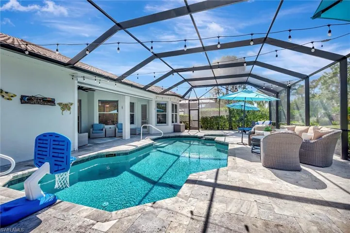 Outdoor pool featuring outdoor lounge area, a lanai, and a patio area