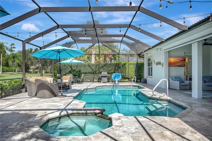View of pool with a patio area, a lanai, a sunroom, and outdoor lounge area