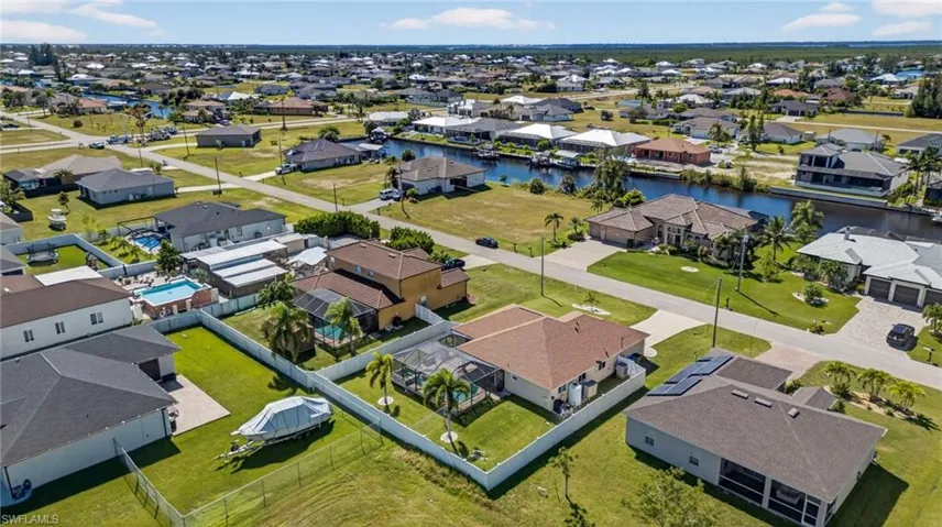 Aerial view of residential area with a large body of water