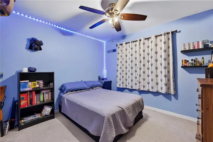 Bedroom with carpet flooring and ceiling fan