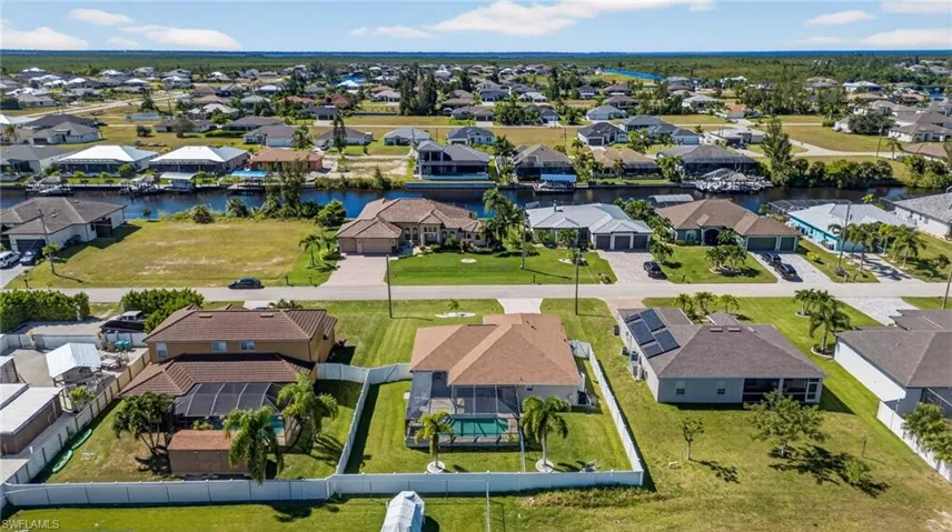 Aerial view of residential area with a large body of water