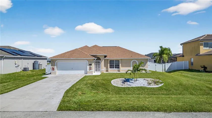 Mediterranean / spanish-style house with driveway, an attached garage, stucco siding, and roof with shingles