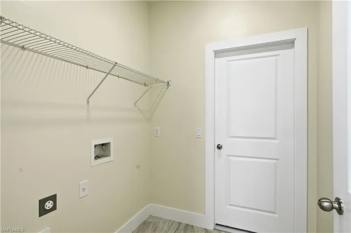 Laundry room with washer hookup and hookup for an electric dryer