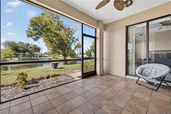 Tiled and screened lanai with ceiling fan, overlooking the freshwater canal. Perfect for morning coffee or evening sunsets.