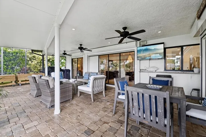 View of patio / terrace Outdoor living space with ceiling fans