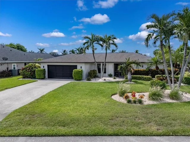 Ranch-style house featuring a 2 car garage