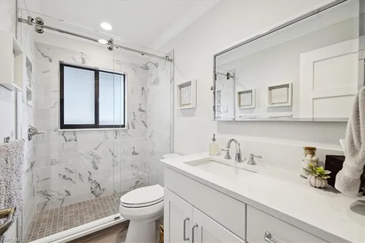 Guest Bathroom featuring vanity & walk in shower