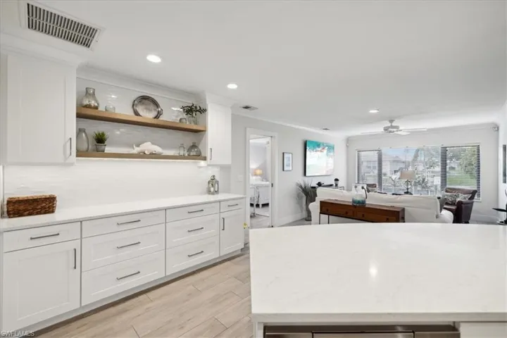 Kitchen with Solid wood white cabinetry, and Quartz counters