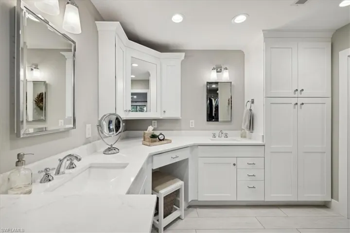 Bathroom with tile floors and Custom Cabinetry