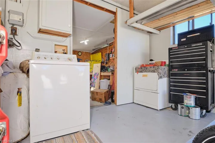 Basement featuring washing machine and clothes dryer